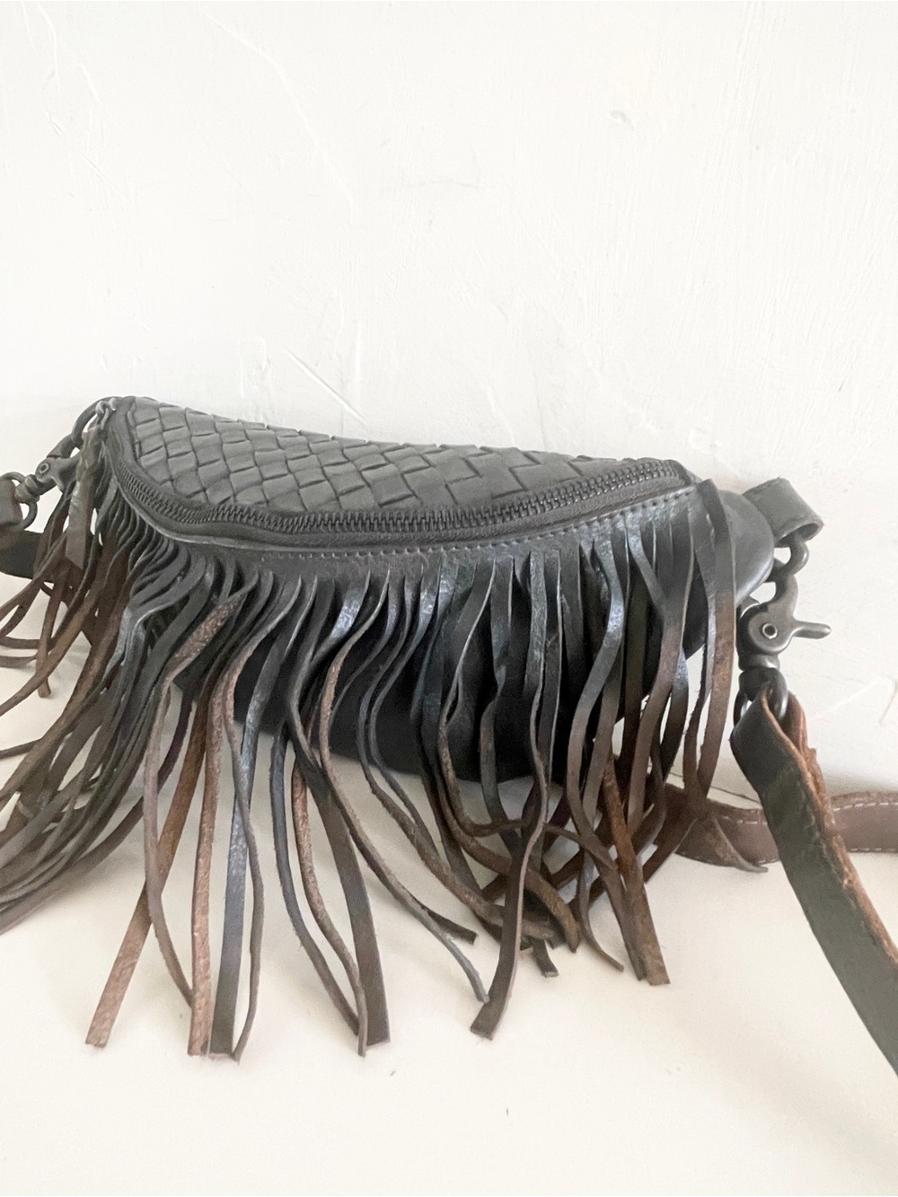 Cut N Paste Woven Leather Fringe Crossbody Bag in a grey brown color